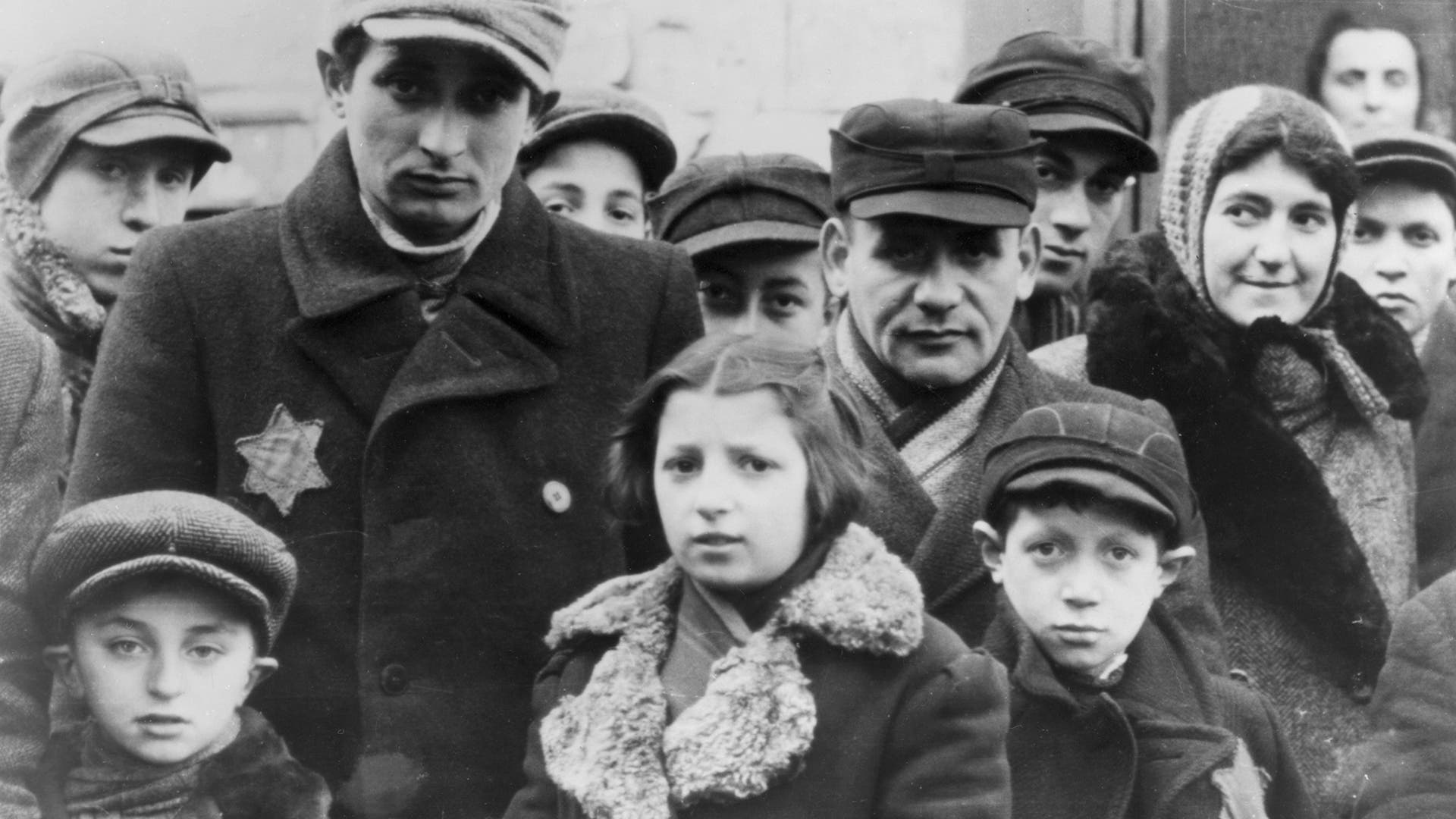 Jews wearing Star of David badges, Lodz Ghetto, Poland, World War II, 1940-1944. The Nazis forced Jews into over-crowded ghettos from which thousands were deported to the death camps.