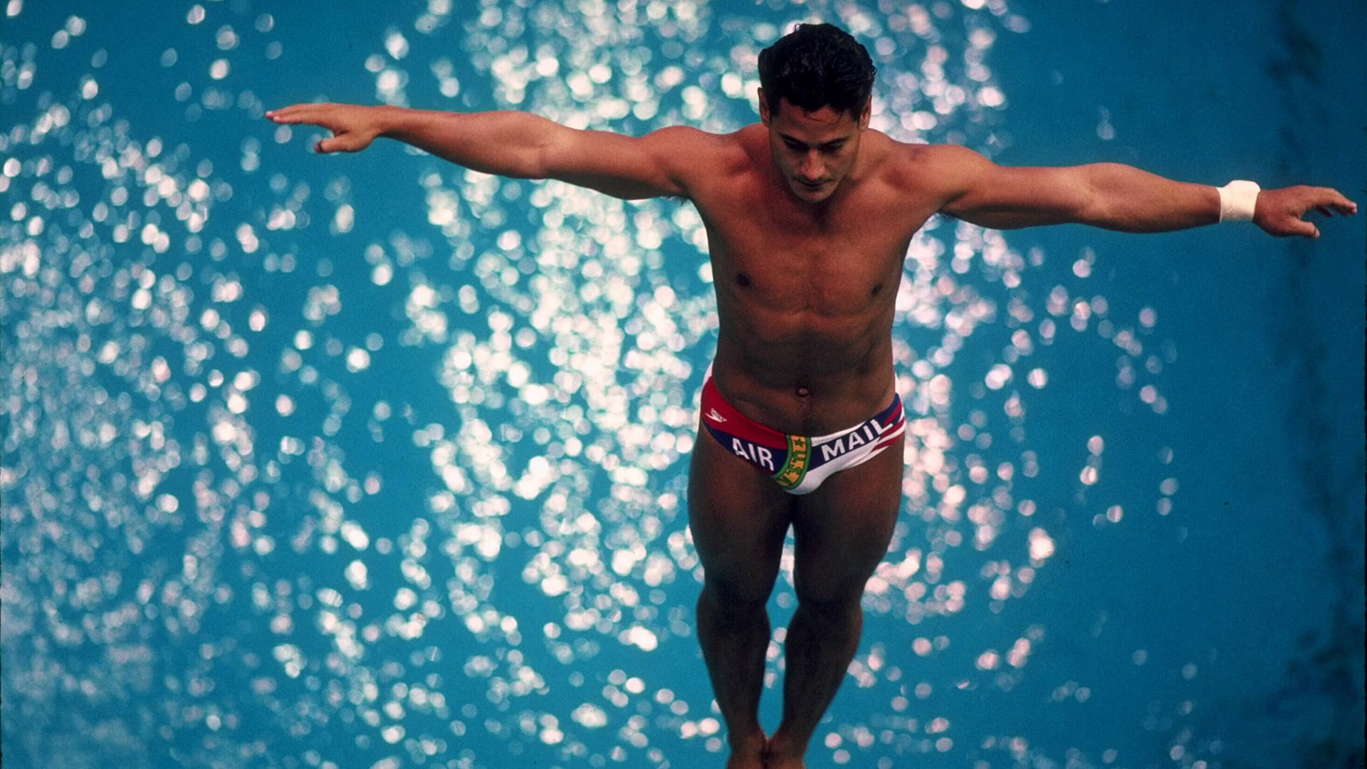 Greg Louganis of the USA sets his feet on the edge of the diving board before attempting a dive in the men's spring board competition during the 1988 Summer Olympic Games held in Seoul, South Korea.
