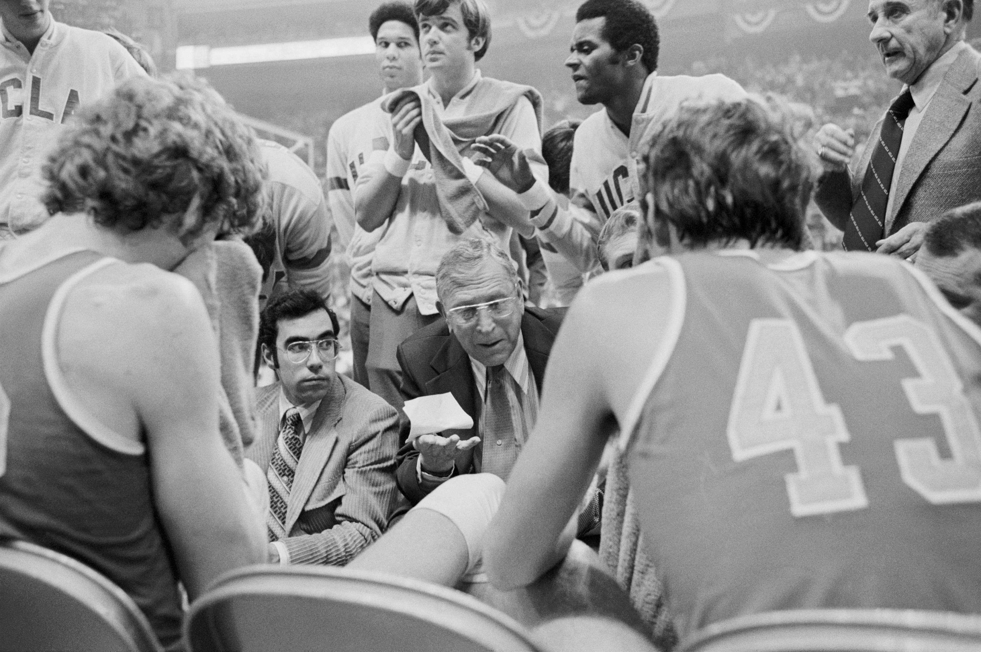 John Wooden (center), shown in the 1974 NCAA Tournament title game, coached UCLA to 10 championships./ Rich Clarkson / NCAA Photos via Getty Images