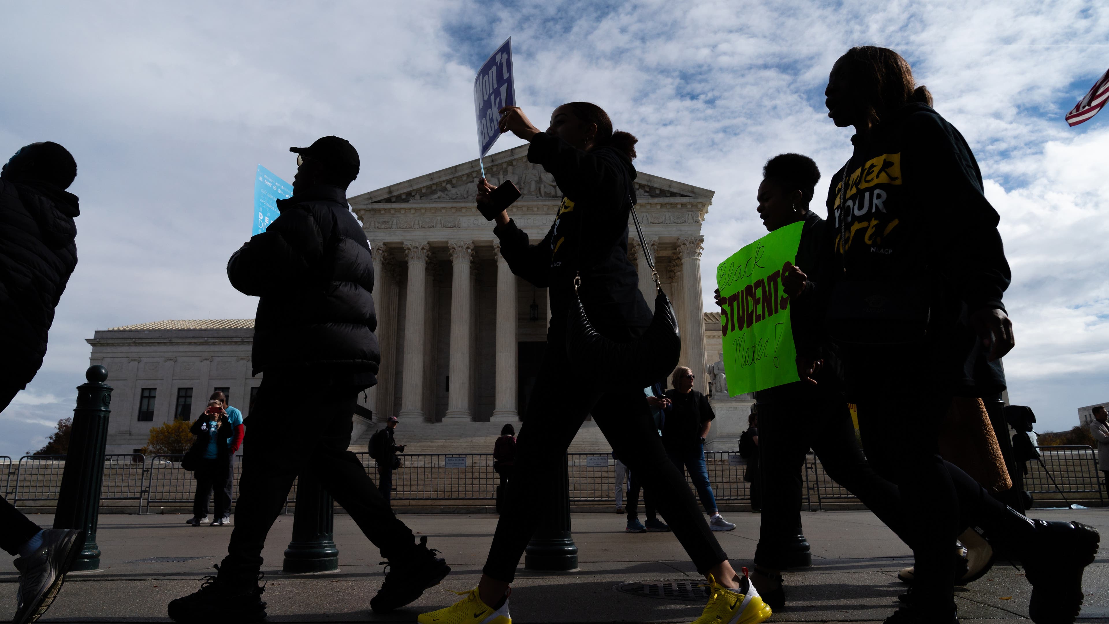 Supporters march during a rally in support affirmative action policies outside the Supreme Court in Washington, D.C. on October 31, 2022.