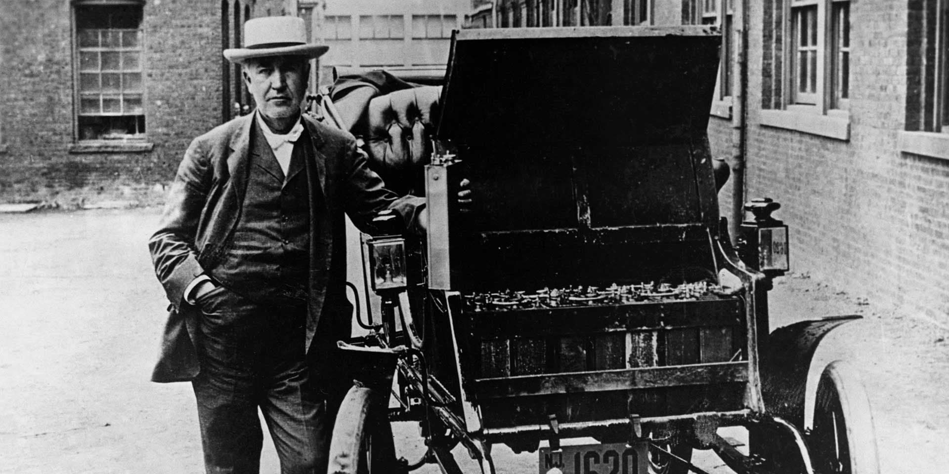 Thomas A. Edison stands next to his American Barker electric car, circa 1895.