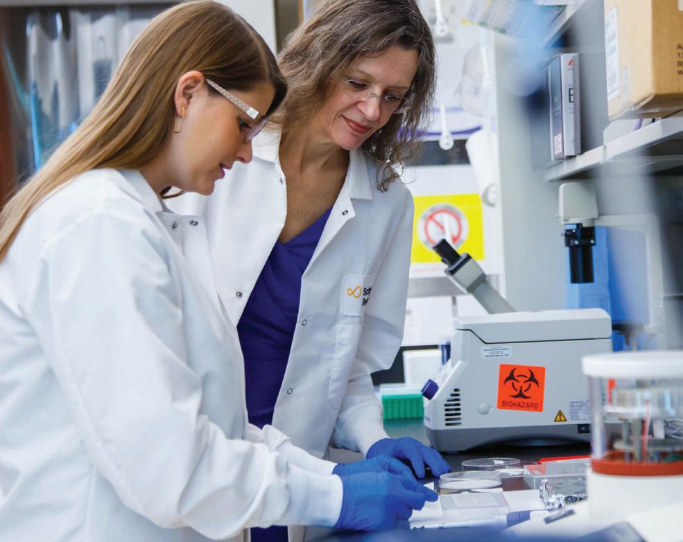 Izard and her research associate, Marino Candido Primi, PhD, demonstrate sample preparation.
