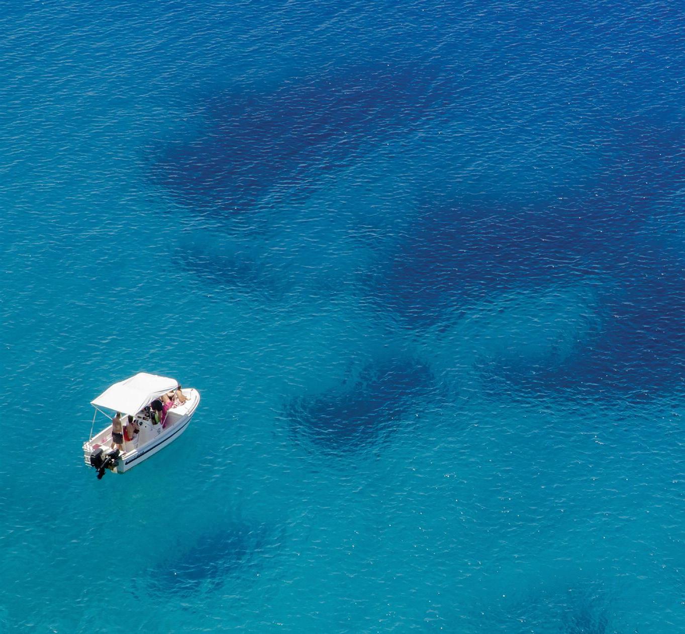 Boat floating in the middle of the Mediterranean Sea