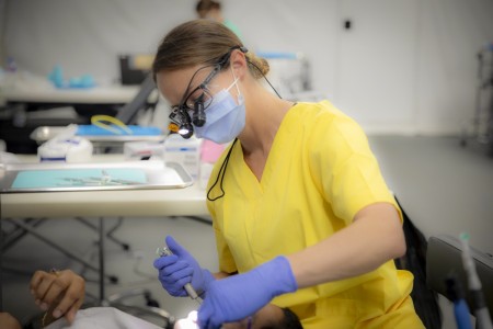 Army Reserve Maj. Lucinda Young, a dentist, performs an exam in Saipan, Northern Mariana Islands, July 14, 2023. Service members provided no-cost health-care services to the communities of Saipan, Tinian and Rota.