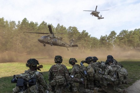 Soldiers assigned to the 1st Battalion, 506th Infantry Regiment ‘Red Currahee,’ 1st Brigade Combat Team, 101st Airborne Division, supporting the 4th Infantry Division, prepare to load into UH-60 Black Hawks during a platoon situational training exercise at Nurispalu Training Area, Estonia, July 25, 2023. The training enabled soldiers to engage in simulated combat scenarios, refine their tactical skills in real-world conditions, and enhance their adaptability to handle challenges on the battlefield.