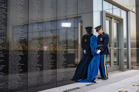 Army Spc. David Lashner, assigned to the 3rd U.S. Infantry Regiment, known as &#34;The Old Guard,&#34; unveils the engraved name of Medal of Honor recipient, retired Army Col. Paris D. Davis, at the National Museum of the U.S. Army at Fort Belvoir, Va., Aug. 9, 2023. Davis received the Medal of Honor from President Joe Biden on March 3, 2023, for his actions while serving in the 5th Special Forces Group (Airborne) in Vietnam in 1965.