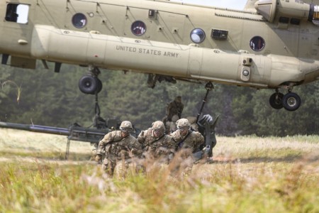 Soldiers sling-load an M777 howitzer onto an Army CH-47 Chinook during Fireball at Fort Liberty, N.C., Aug. 22, 2023. The exercise is designed to prepare, train and execute a mission to measure readiness and lethality.