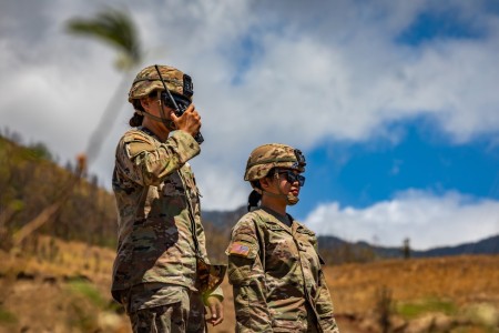Hawaii Army National Guard Spc. Keana Makai-Dacosin, left, a motor transport operator and Army Spc. Janiele L. Bonilla, an automated logistical specialist, both assigned to Joint Task Force 5-0, observe the mountainside of Lahaina during a fire watch in Lahaina, Maui, Sept. 1, 2023.