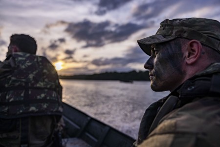 U.S. Army Soldier, Staff Sgt. Justin Reeb, squad leader assigned to 1st Battalion, 26th Infantry Regiment, 2nd Brigade Combat Team, 101st Airborne Division (Air Assault), transports in a boat after a platoon-level jungle mock-reconnaissance on an island in Oiapoque, Brazil, during Exercise Southern Vanguard 24, Nov. 13, 2023.