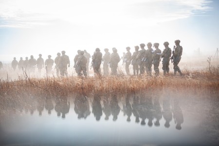 U.S. Army Soldiers assigned to the 4th Infantry Division walk onto a land navigation course in pursuit of the Expert Infantryman, Soldier or Field Medical Badge on Fort Carson, Colorado, Dec. 4, 2023. Land navigation prepares Ivy Soldiers for navigating unfamiliar territory in a combat situation.