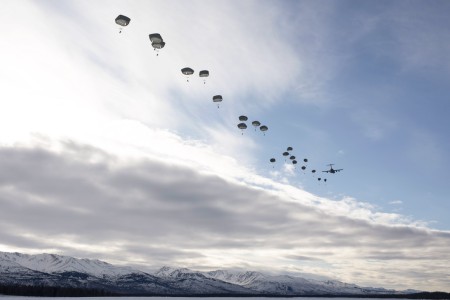 Soldiers jump from an Air Force C-17 Globemaster III during an all-female flight in honor of International Women&#39;s Day at Malemute Drop Zone at Joint Base Elmendorf-Richardson, Alaska, March 7, 2024.