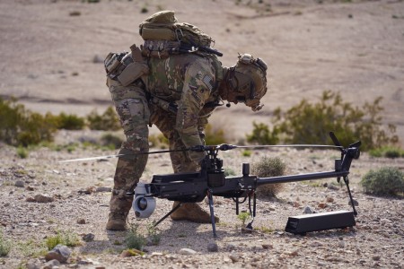 U.S. Army Staff Sgt. Stetson Manuel, a Robotics and Autonomous Systems platoon sergeant and infantryman, assigned to the Alpha Company, 1st Battalion, 29th Infantry Regiment, 316th Cavalry Brigade, assembles the Ghost-X Unmanned Aircraft System during the human machine integration experiment for Project Convergence – Capstone 4 in Fort Irwin, Calif., March 11, 2024.