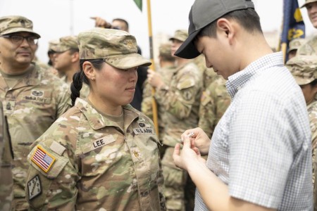 Maj. Grace Lee, assigned to Headquarters and Headquarters Company (HHC), 23d CBRNE (Chemical, Biological Radiological, Nuclear and Explosive) Battalion, 2nd Infantry Division (2ID) Sustainment Brigade, 2ID ROK-U.S. Combined Division (RUCD), is pinned her Expert Soldier Badge (ESB) by her spouse, on April 26th, 2024, at Camp Humphreys, South Korea. The ESB is a special skills badge of the U.S. Army, awarded to those who demonstrate individual Soldier competencies and abilities to perform Skill Level 1 Warrior Tasks and brigade commander-selected tasks, wherein the training and testing are expected to be tough, realistic, and mission focused.