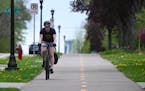 Sean Gulbranson commutes home to Roseville along a bike path on Como Avenue in St. Paul.
