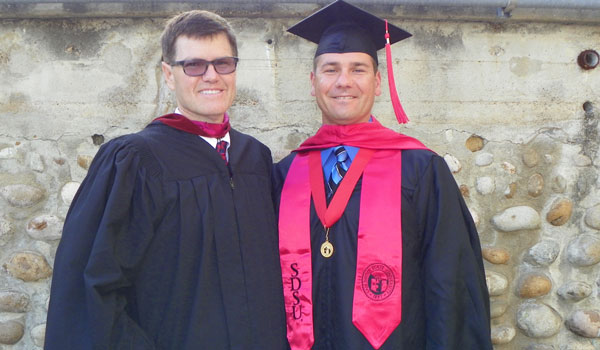 Top student, Samardzic, with his most influential professor, Frank Ryan at commencement in 2014