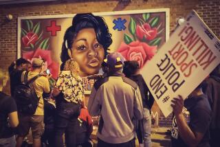 Protesters gather at a mural of Breonna Taylor in Milwaukee.