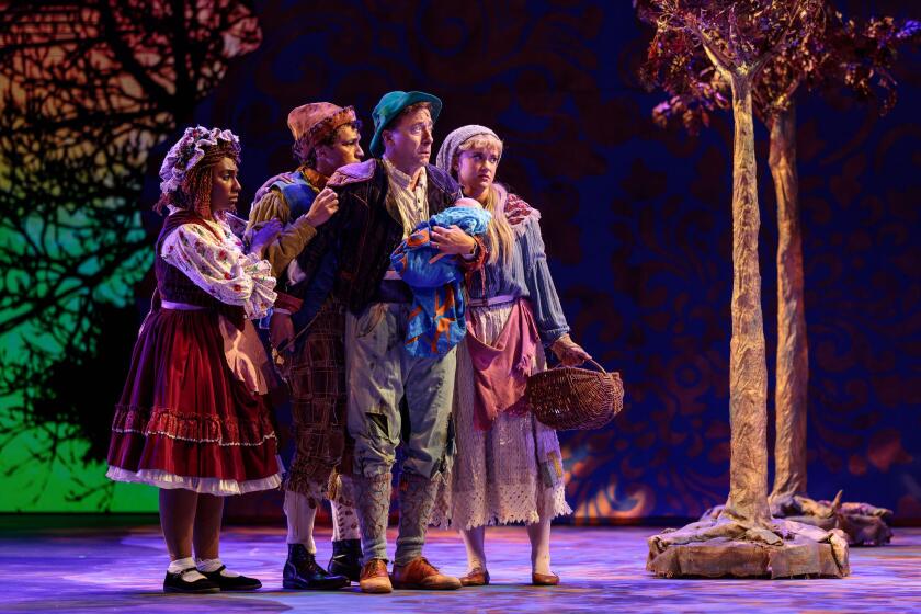 Four actors dressed as fairy tale characters onstage in "Into the Woods."
