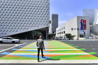(FILES) In this file photo taken on September 14, 2017 a man crosses a pedestrian crossing painted by Venezuelan artist Carlos Cruz-Diez toward the Broad Museum in Los Angeles, California. - Venezuelan kinetic atist Carlos Cruz-Diez passed away on July 27, 2019 in Paris at 95, according to a report released on his website Sunday. (Photo by FREDERIC J. BROWN / AFP) / RESTRICTED TO EDITORIAL USE - MANDATORY MENTION OF THE ARTIST UPON PUBLICATION - TO ILLUSTRATE THE EVENT AS SPECIFIED IN THE CAPTIONFREDERIC J. BROWN/AFP/Getty Images ** OUTS - ELSENT, FPG, CM - OUTS * NM, PH, VA if sourced by CT, LA or MoD **