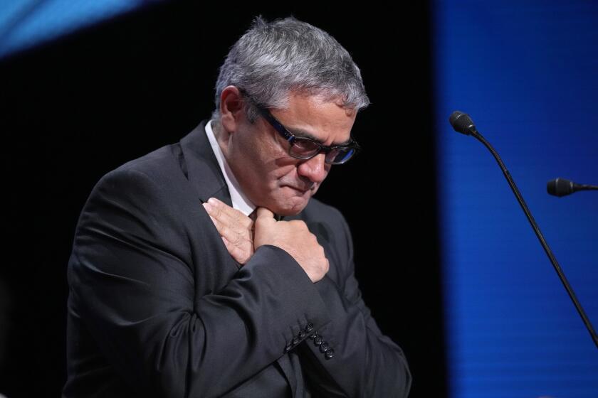 Mohammad Rasoulof accepts the special prize award for the film 'The Seed of the Sacred Fig' during the awards ceremony of the 77th international film festival, Cannes, southern France, Saturday, May 25, 2024 (Photo by Andreea Alexandru/Invision/AP)