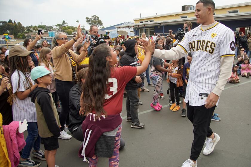 San Diego, California - May 13: Padres All-Star third baseman Manny Machado makes a surprise appearance at a Paradise Hills Elementary School assembly to congratulate students for winning the "Be a Pro and Always Go" Attendance Challenge. Machado greets the students in Paradise Hills on Monday, May 13, 2024 in San Diego, California. (Alejandro Tamayo / The San Diego Union-Tribune)