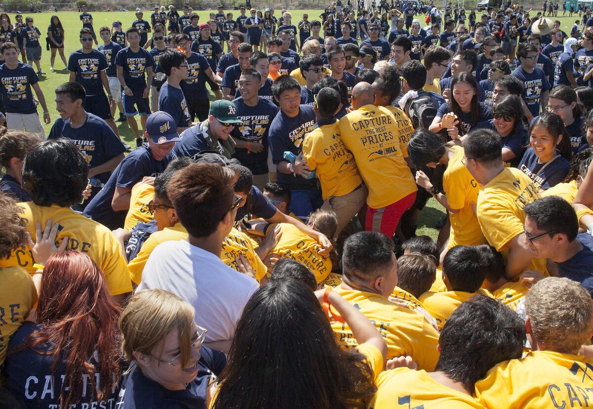 Gold team members attempt to push past members of the the blue team as UC Irvine students break a world record for the largest game of capture the flag at Anteater Recreation Center fields on Tuesday. UC Irvine set a new world record with 2,888 participants.