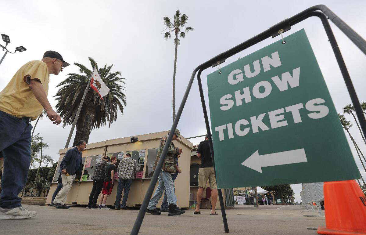People buy tickets to the Crossroads of the West Gun Show at San Diego County's Del Mar Fairgrounds in 2019.
