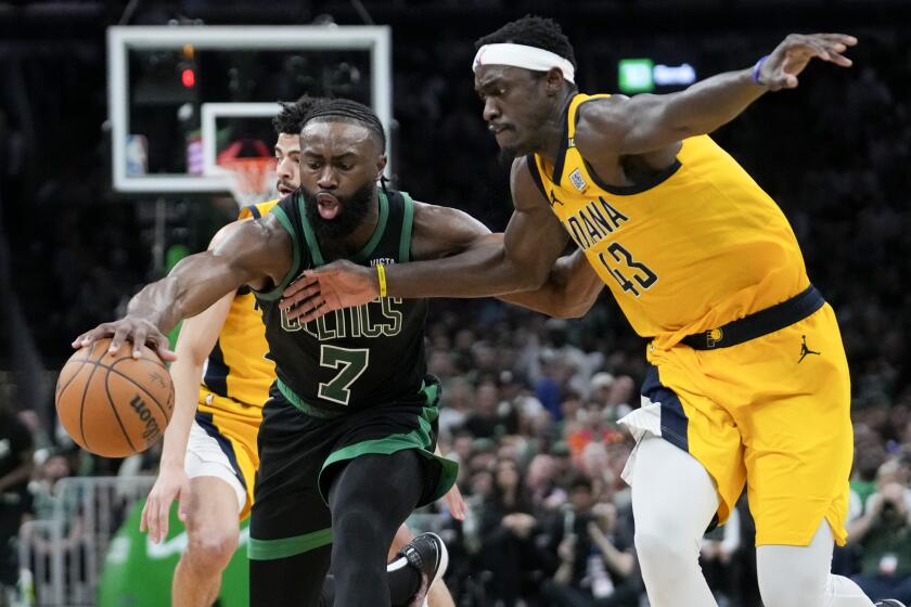 Boston Celtics guard Jaylen Brown (7) is defended by Indiana Pacers forward Pascal Siakam.