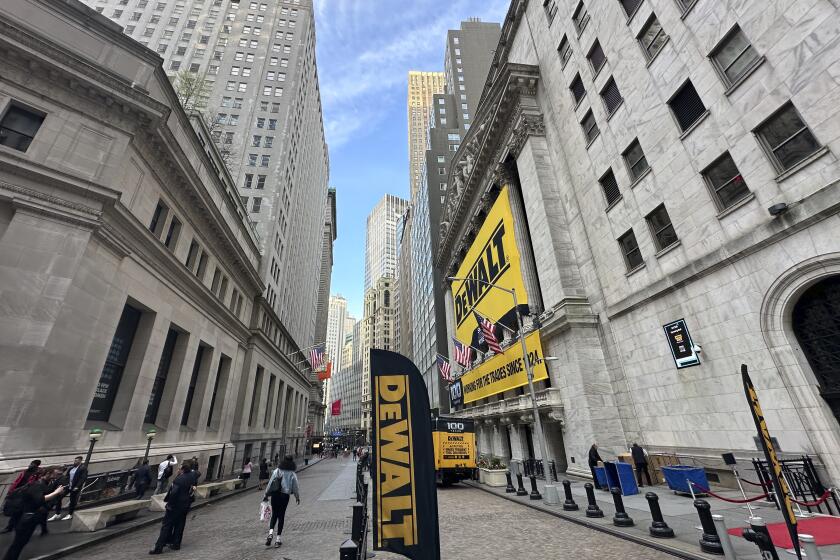 The front of the New York Stock Exchange is adorned with signs for the tool maker DeWalt in honor of the 100th year anniversary of the company on Tuesday, May 14, 2024. Markets on Wall Street inched slightly higher ahead of the release of more inflation data from the U.S. government. (AP Photo/Peter Morgan)
