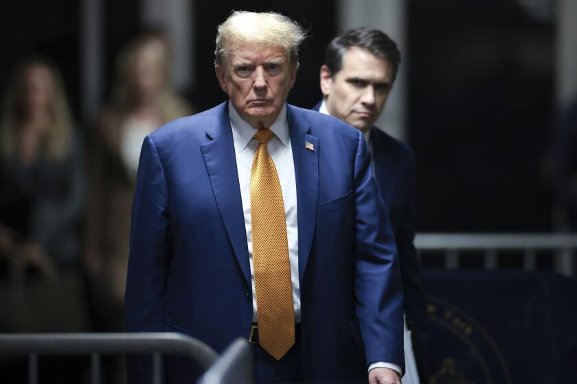 Former President Donald Trump, followed by his attorney Todd Blanche, walks to speak to reporters following the day's proceedings in his trial, Tuesday, May 7, 2024, in New York. (Win McNamee/Pool Photo via AP)