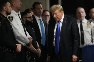 Former President Donald Trump walks to make comments to members of the media