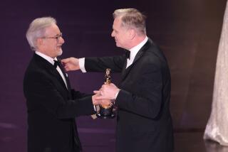 Hollywood, CA - March 10: Chirstopher Nolan and Steven Spielberg during the live telecast of the 96th Annual Academy Awards in Dolby Theatre at Hollywood & Highland Center in Hollywood, CA, Sunday, March 10, 2024. (Myung J. Chun / Los Angeles Times)