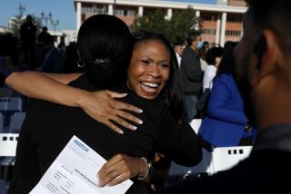 LOS ANGELES, CA - MARCH 18: Eden Patton, center, medical student, celebrates with Ryan Ine Woodson, left, medical student, after being accepted for residency at UC San Francisco on Match Day, at the David Geffen School of Medicine at UCLA on Friday, March 18, 2022 in Los Angeles, CA. Match Day is when medical students nationwide learn which hospital has accepted them for residency, or advanced training in their chosen clinical specialty. 155 UCLA medical students opened residency acceptance envelopes. Due to COVID-19, this was the first in-person Match Day ceremony since 2019. (Gary Coronado / Los Angeles Times)