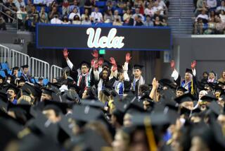 Los Angeles, California-June 14, 2024-During the commencement ceremony for the UCLA College of Letters & Science Commencement on June 14, 2024, several students stood holding their hands up painted red, as a sign of protest. (Wally Skalij/Los Angeles Times)