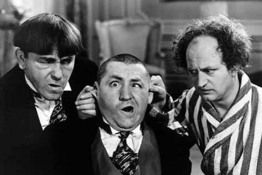 The Three Stooges' Moe Howard, left, Curly Howard and Larry Fine