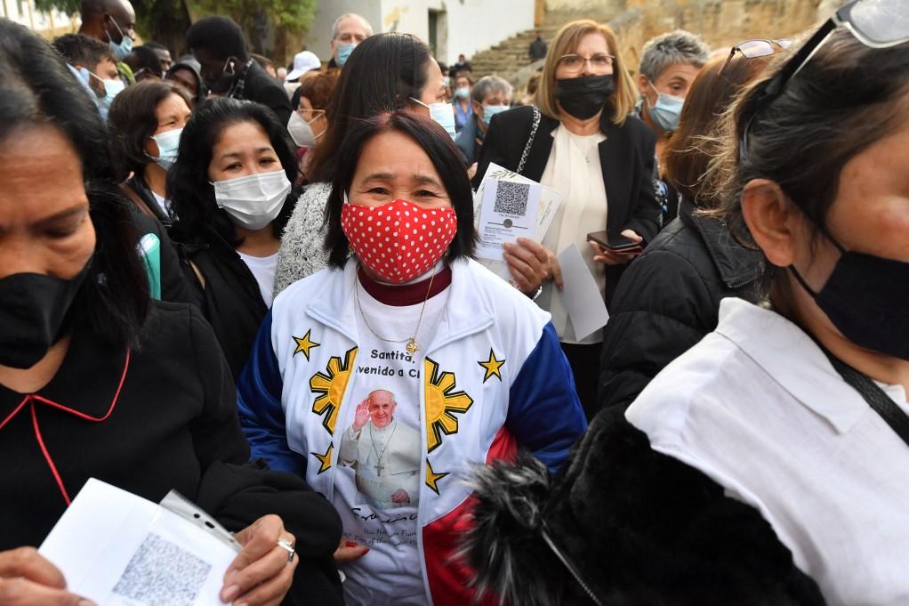 People wear masks in Nicosia, Cyprus for the visit of Pope Francis earlier this month. Photo: AFP