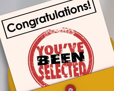 An image of a congratulatory flier sticking out of a manila folder with the text &quot;You&#x27;ve been selected&quot;