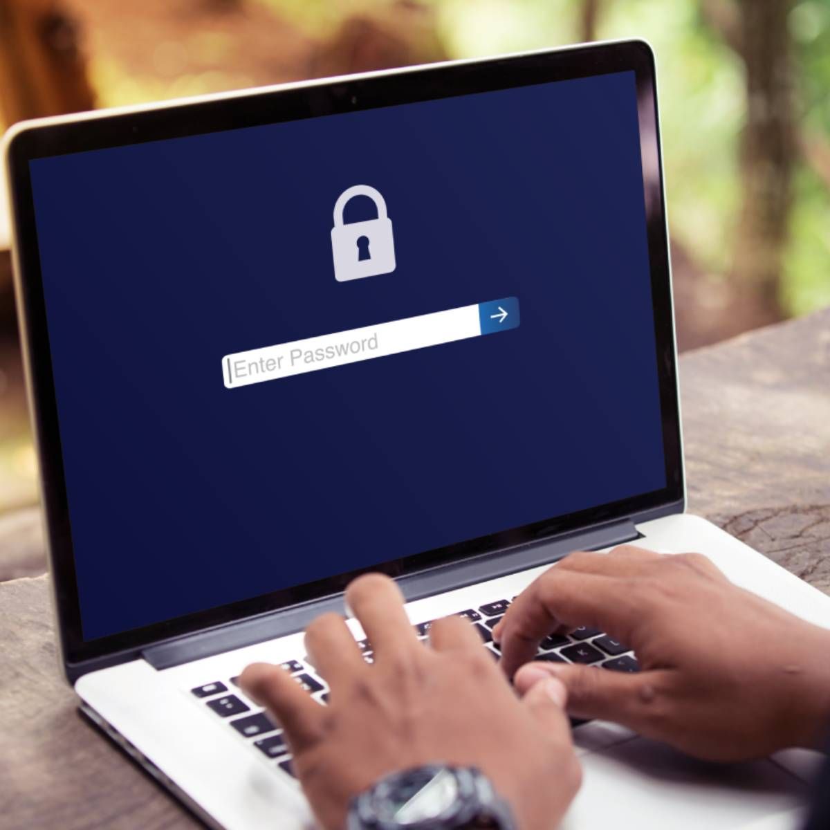A user logging in to a password protected laptop.