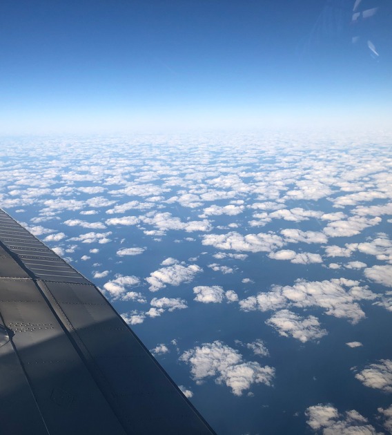 a view of clouds from the window of an aircraft