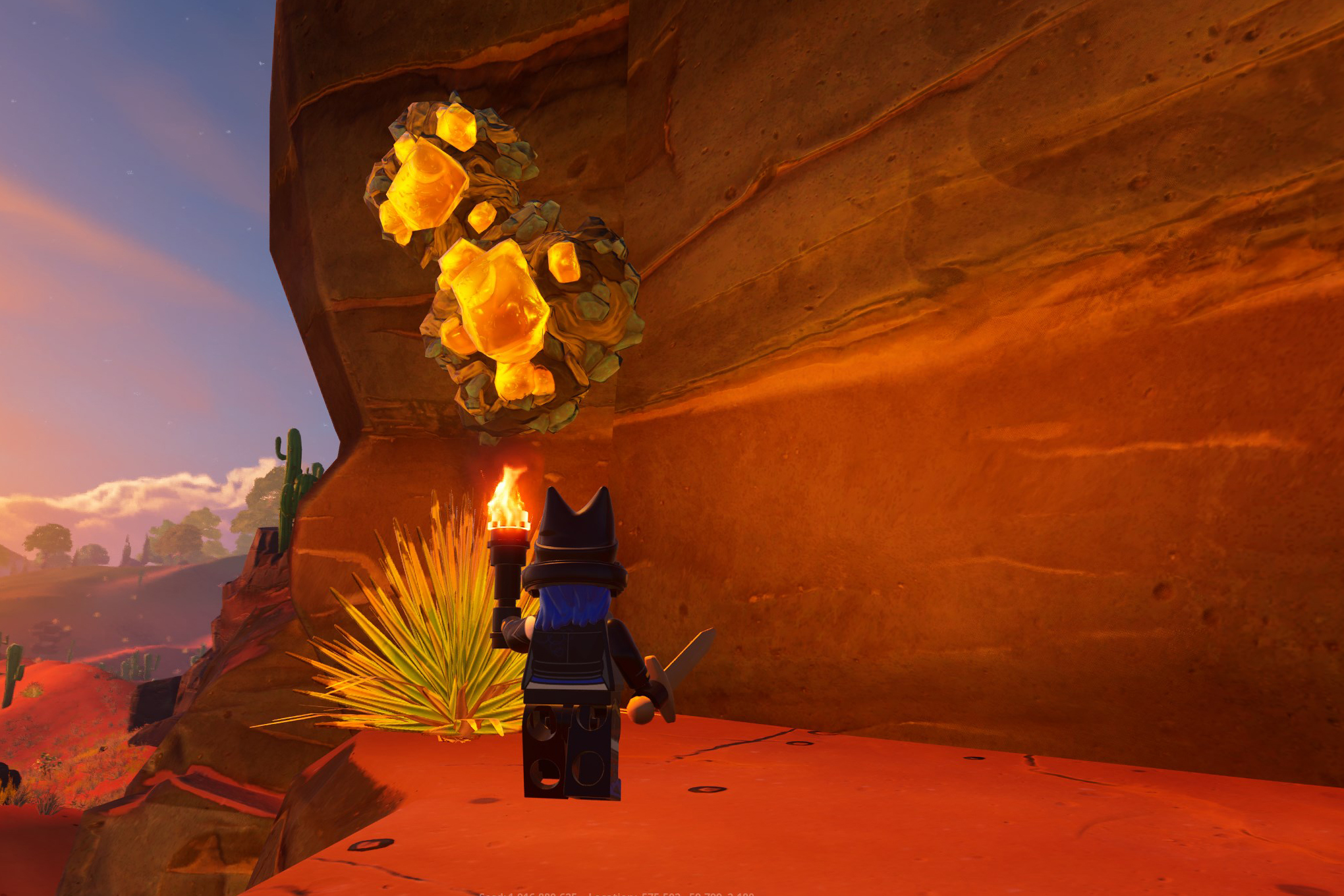 A Lego Fortnite character looks at rough amber on a cliff.