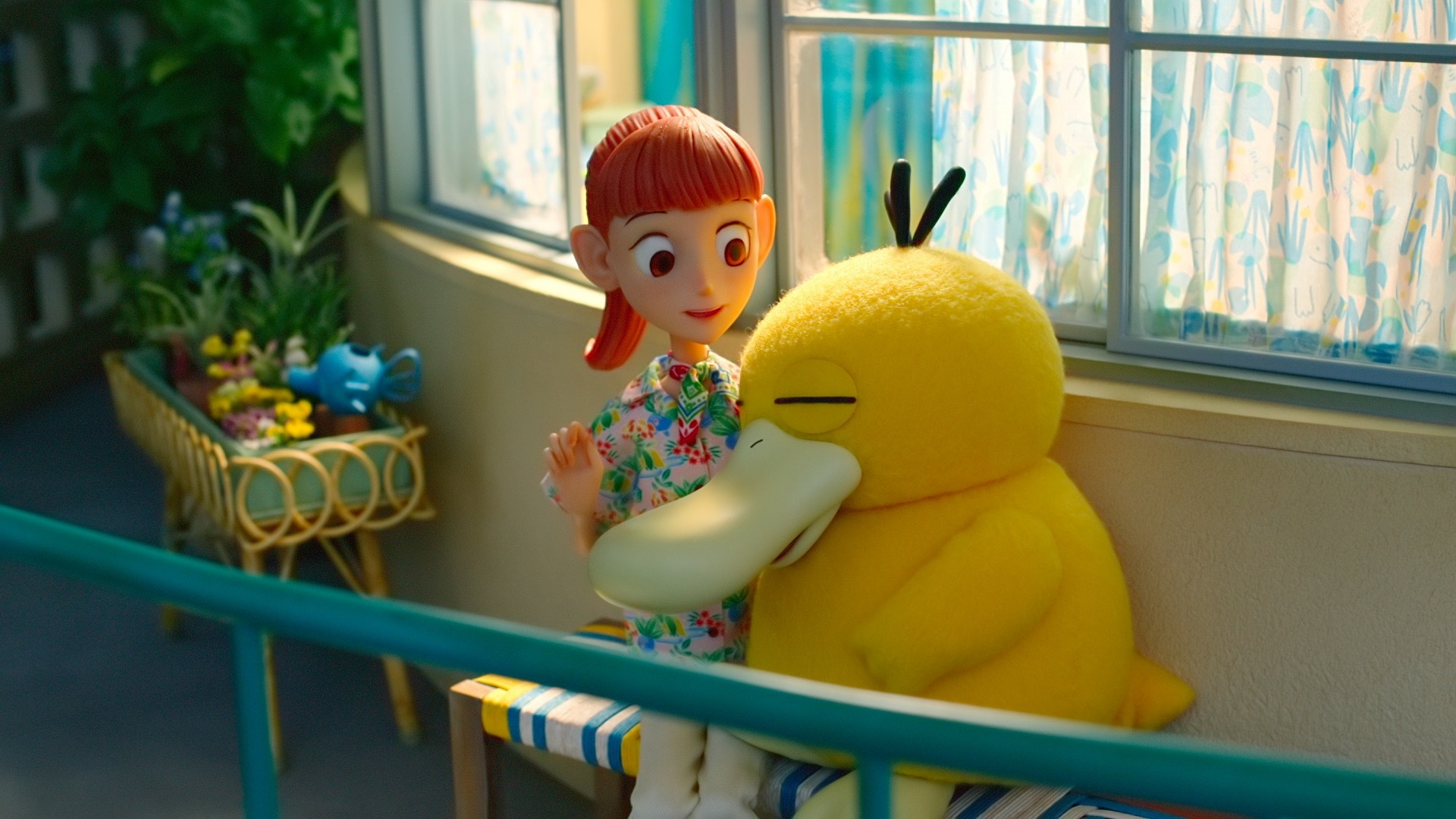 A still from the stop-animation show Pokemon Concierge. It shows Haru and Pysduck sitting outside and eating ice cream. The Pysduck is cuddled up next to her. Pysduck is made with a fuzzy, felt-like cloth.