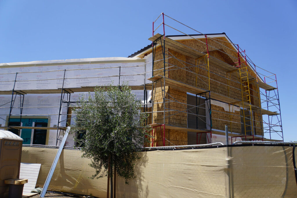 Scaffolding surrounding a home being built