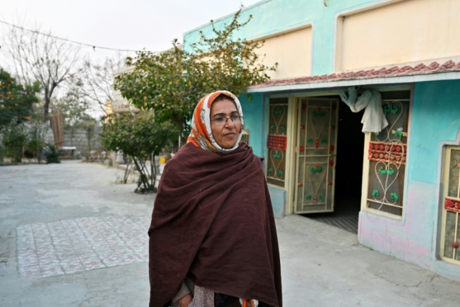 Robina Kausir, a healthcare worker, talks to AFP in Dhurnal of Punjab province, ahead of the upcoming general election