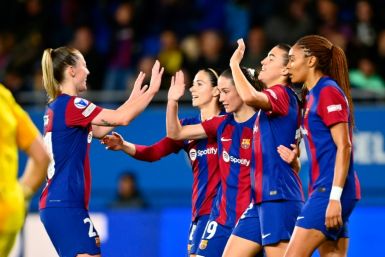 Barcelona's Spanish midfielder Patri Guijarro (2nd-R) is hoping it's third time lucky for her side against Lyon