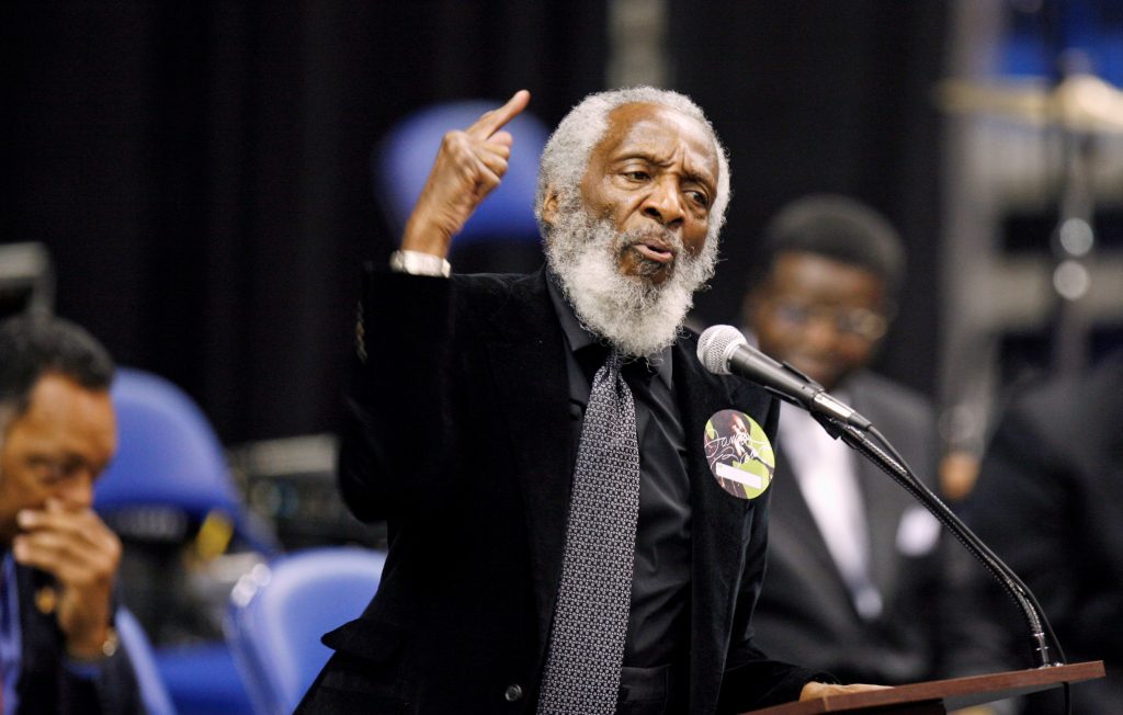 FILE PHOTO - Activist Dick Gregory delivers a speech during a public viewing and funeral for legendary singer James Brown ...