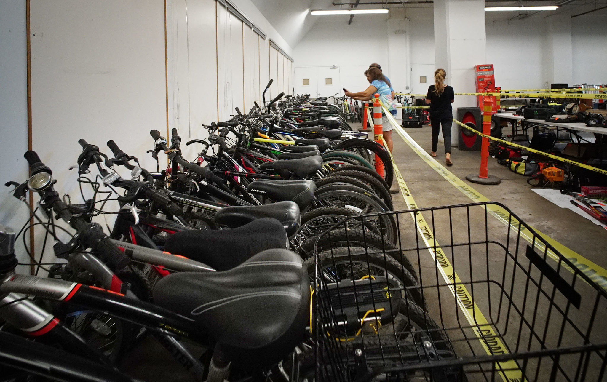 Hundreds of items at the HPD Forfeited Items Auction held at Dole Cannery including scores of bicycles. Signs posted 'Please do not touch or handle anything in the auction". Potential buyers were not allowed to touch the items. 18 aug 2018