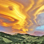 Lenticular clouds over hills in New Zealand.