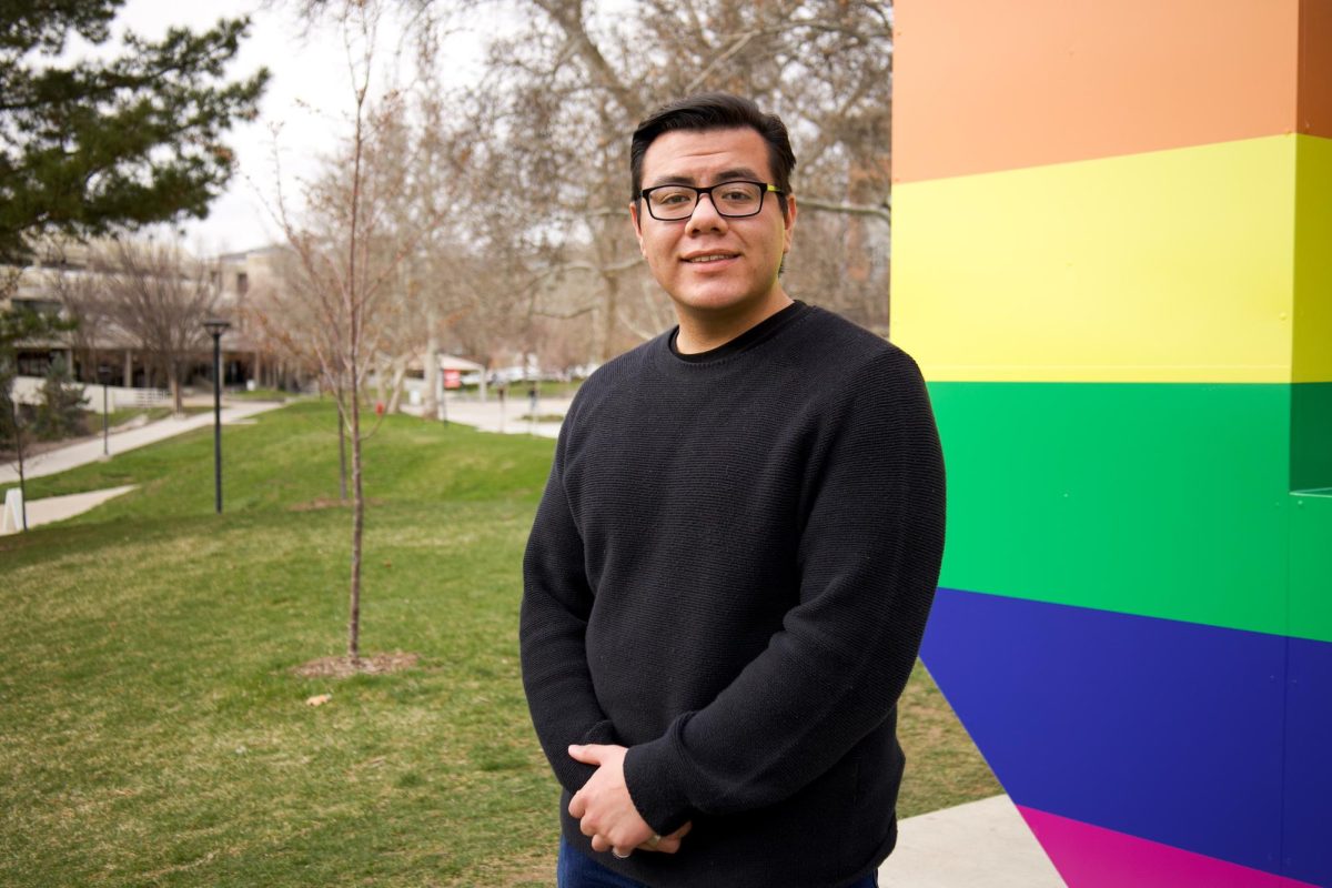 Andre Montoya, arts writer of the Daily Utah Chronicle, poses for a photo in front of the Block U at University of Utah in Salt Lake City on March 27, 2024. (Photo by Minh Polaris Vuong | The Daily Utah Chronicle)