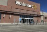 FILE - Shoppers exit a Walmart store, Feb. 21, 2024, in Englewood, Colo. Walmart on Tuesday, May 14, 2024, announced layoffs affecting several hundred jobs at the retail giant’s campus offices. (AP Photo/David Zalubowski, File)