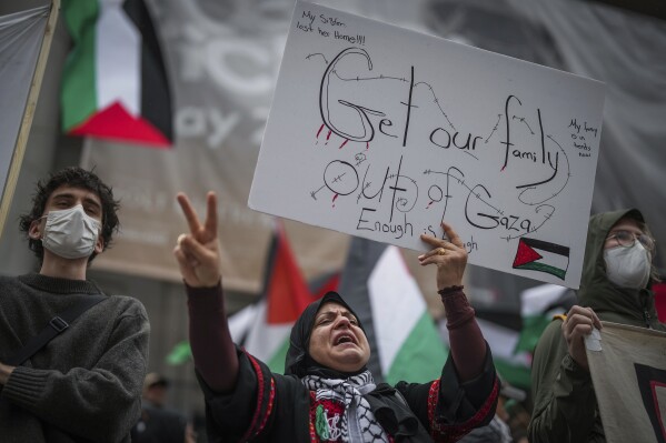 A Palestinian supporter holds a sign and chants while attending a demonstration in Vancouver, British Columbia, on Monday, Oct. 9, 2023. (Darryl Dyck/The Canadian Press via AP, File)