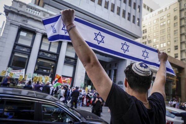 Hundreds of Palestinian and Israeli supporters gather outside of the Consulate of Israel in San Francisco on Sunday, Oct. 8, 2023. (Bronte Wittpenn/San Francisco Chronicle via AP, File)